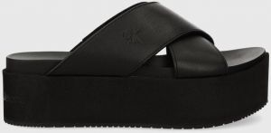 Kožené šľapky Calvin Klein Jeans FLATFORM CROSS MG UC dámske, čierna farba, na platforme, YW0YW01349